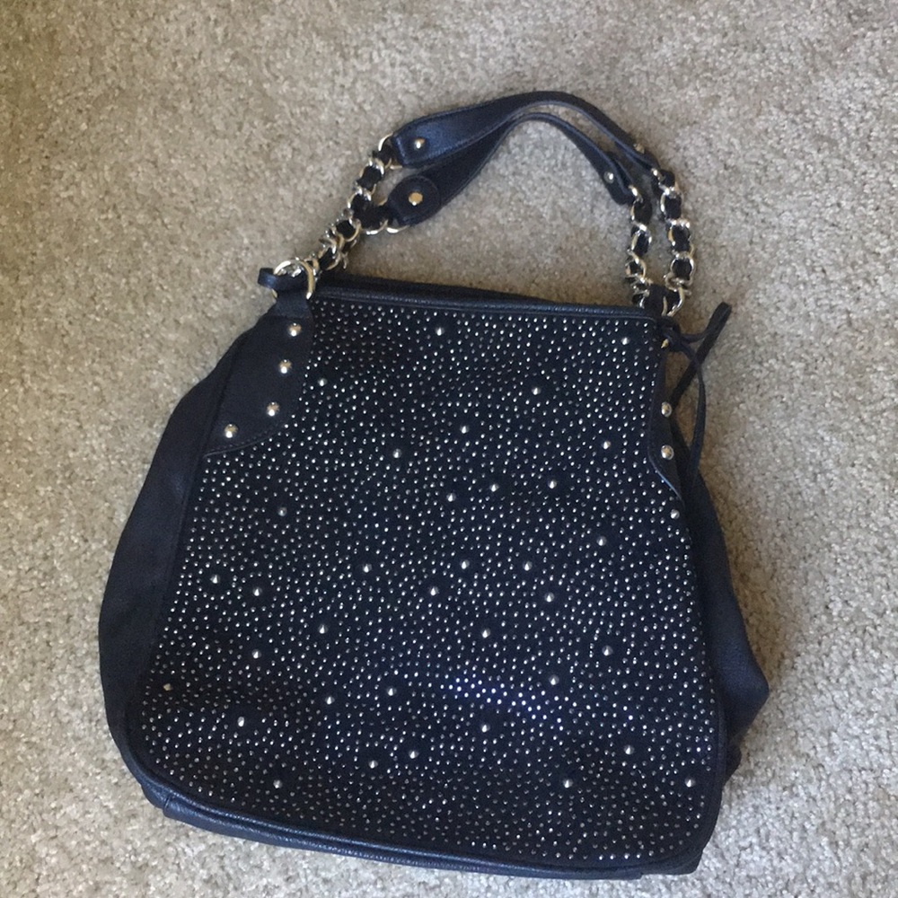 Carlos Santana purse